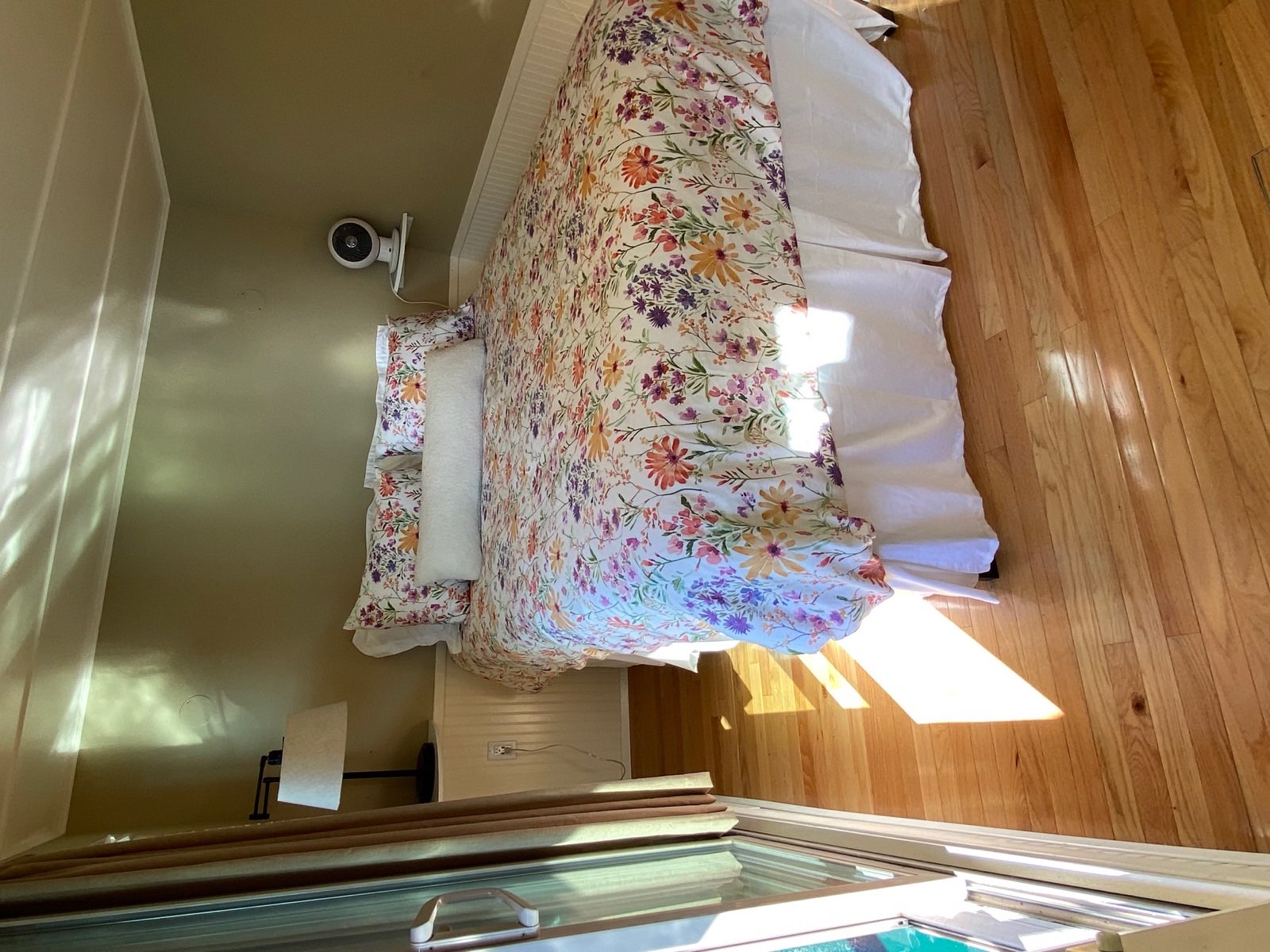 Primary bedroom with queen bed and lake view